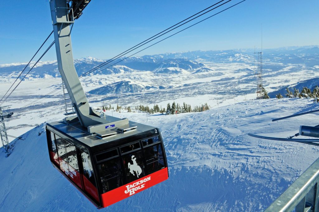 Ski lift cable car moving over snowy mountain in Jackson Hole