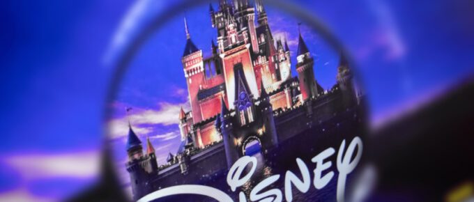 A photo of the home page of the Disney site, view through a magnifying glass.