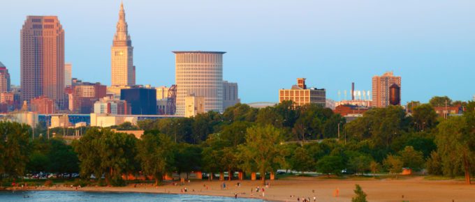 City of Cleveland, Ohio, and beach at Edgewater State Park at sunset.