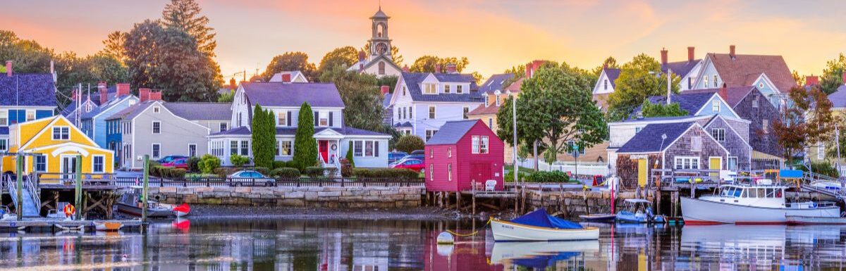 Colorful houses near a body of water in Portsmouth, New Hampshire, USA townscape.