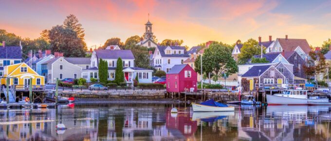 Colorful houses near a body of water in Portsmouth, New Hampshire, USA townscape.