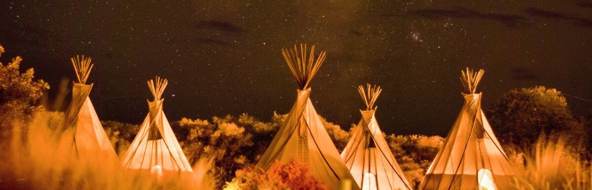 Glamping tents during nighttime in El Cosmico, Marfa, United States.