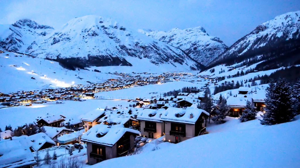 a snow-covered skiing village in Italy