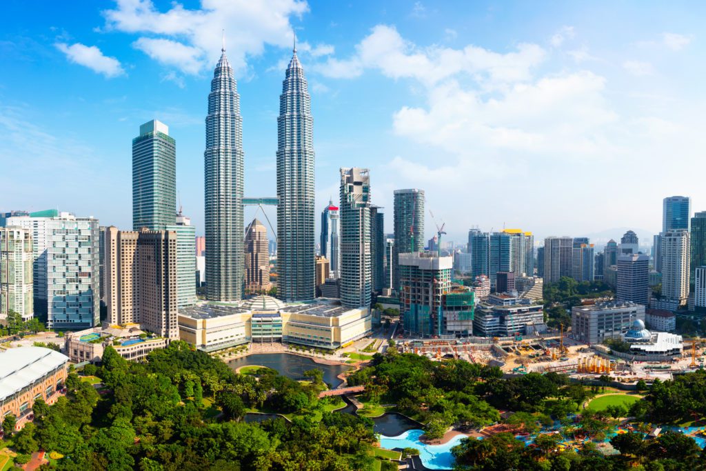 A skyline of Kuala Lumpur in Malaysia , showing the Patronas Towers.