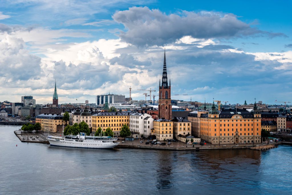 a city skyline in Sweden, backing onto a river