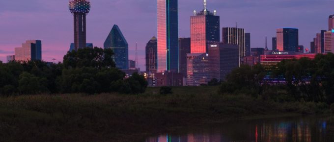 Evening sunset view of Downtown Dallas, Texas from across the Trinity River.