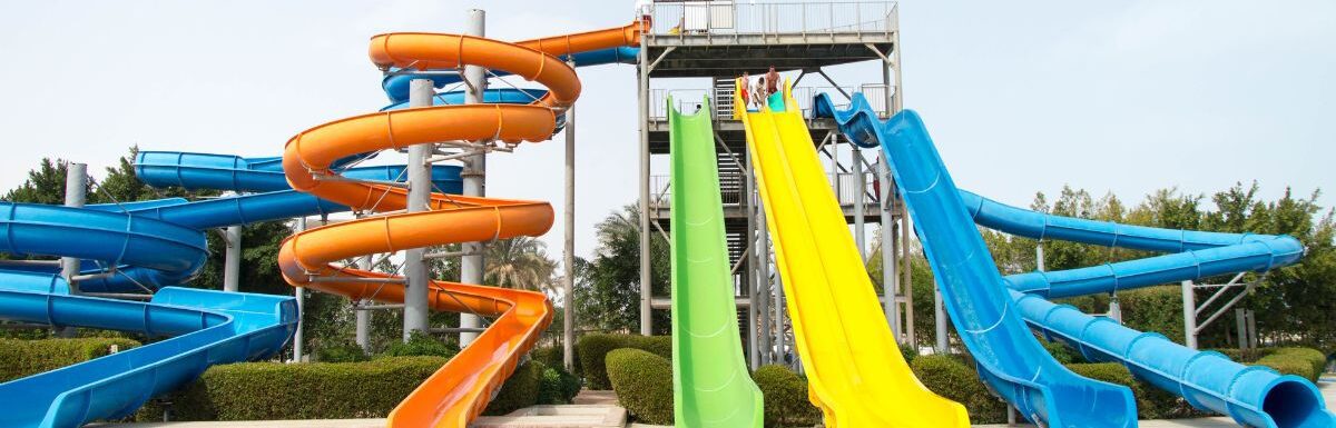 A resort with a waterpark and colorful slides.