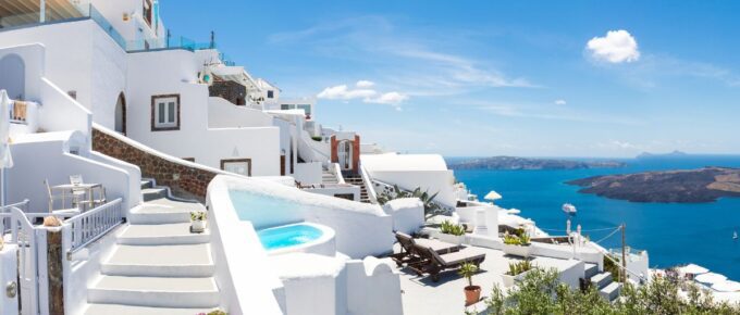 Beautiful panoramic view of picturesque town in Santorini, caldera and volcano on the Mediterranean Sea.